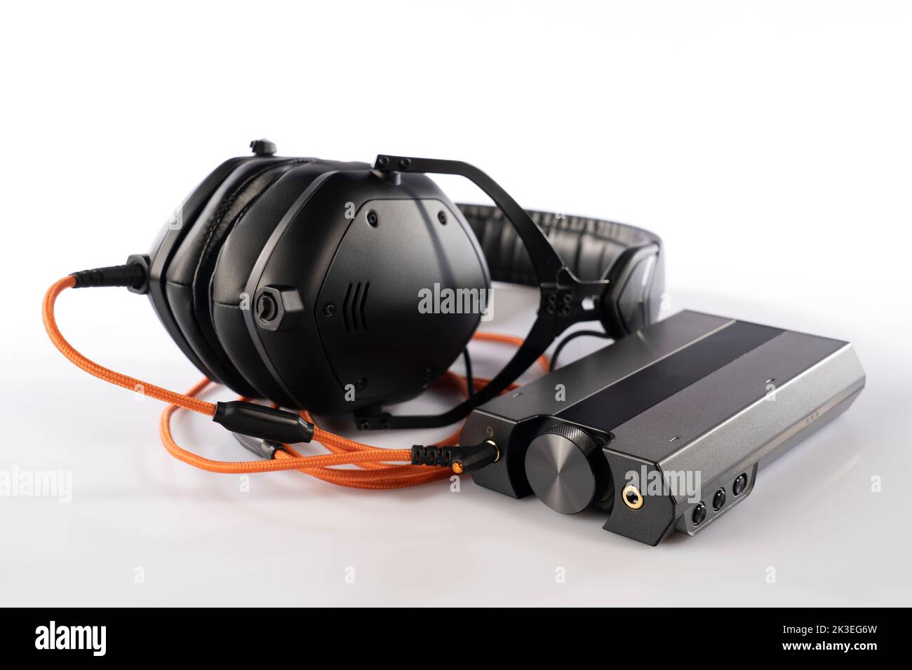 External sound card and DAC connected to headphones with the orange