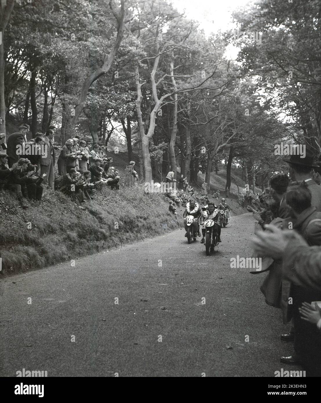 1954, historical, in a wooded section of a forest, overlooking a road on the Mount Oliver race