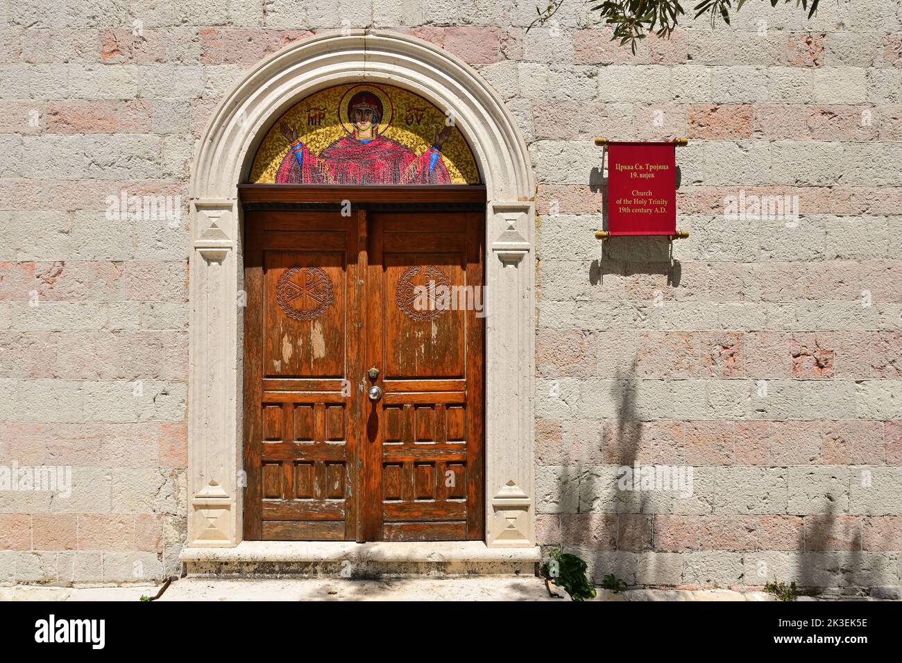 Doors to the church of the Holly Trinity in Budva Old Town. Montenegro Stock Photo