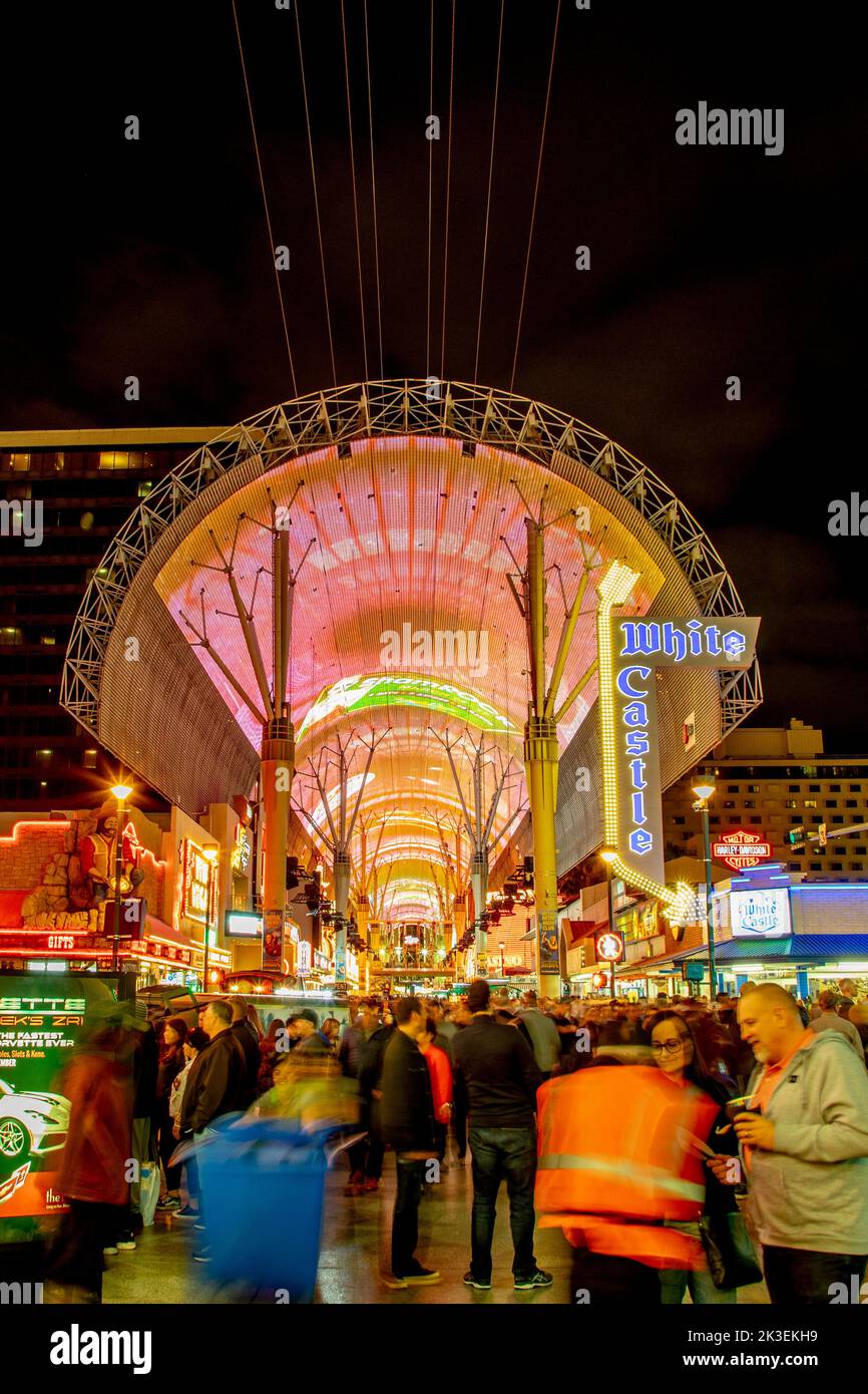 Las Vegas, USA - March 9, 2019: Fremont Street with many neon lights and tourists in downtown Las Vegas. It was the first paved street in Las Vegas in Stock Photo