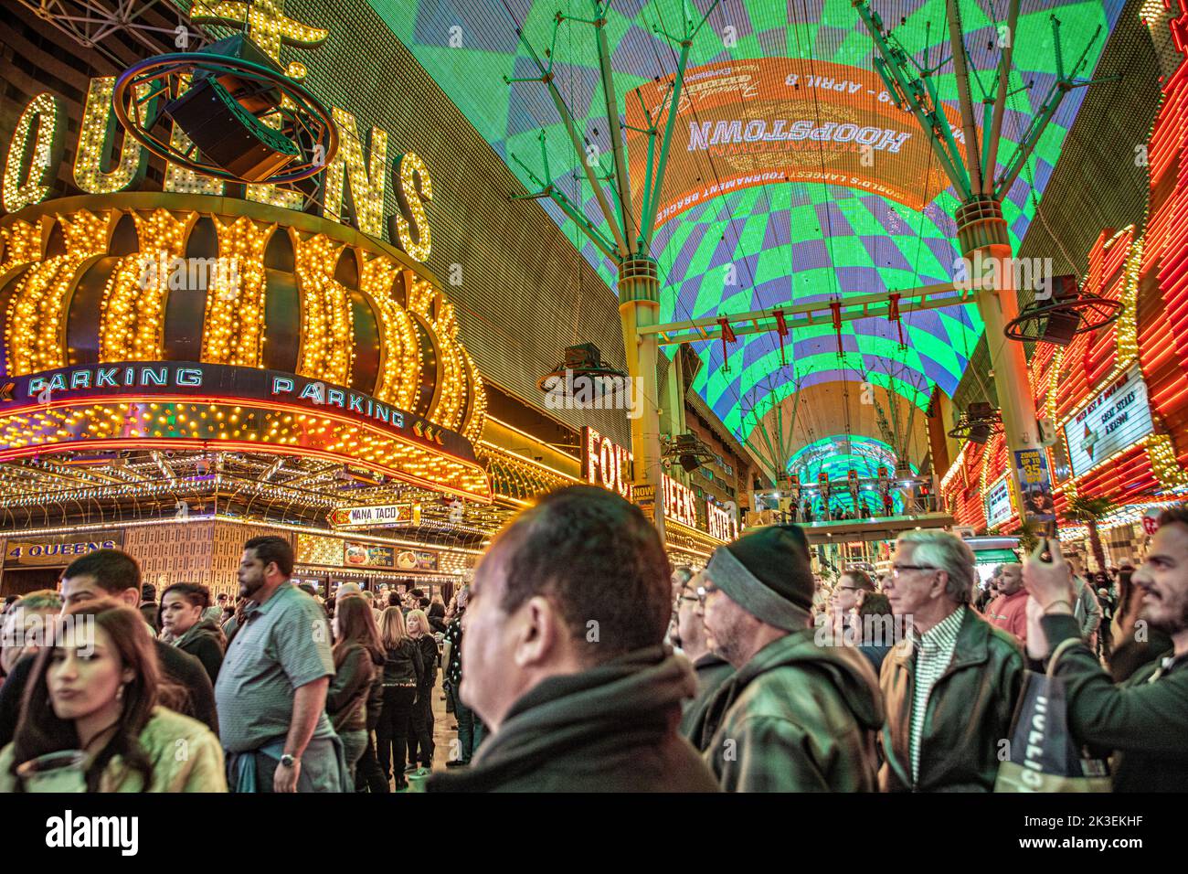 Las Vegas, USA - March 9, 2019: Fremont Street with many neon lights and tourists in downtown Las Vegas. It was the first paved street in Las Vegas in Stock Photo