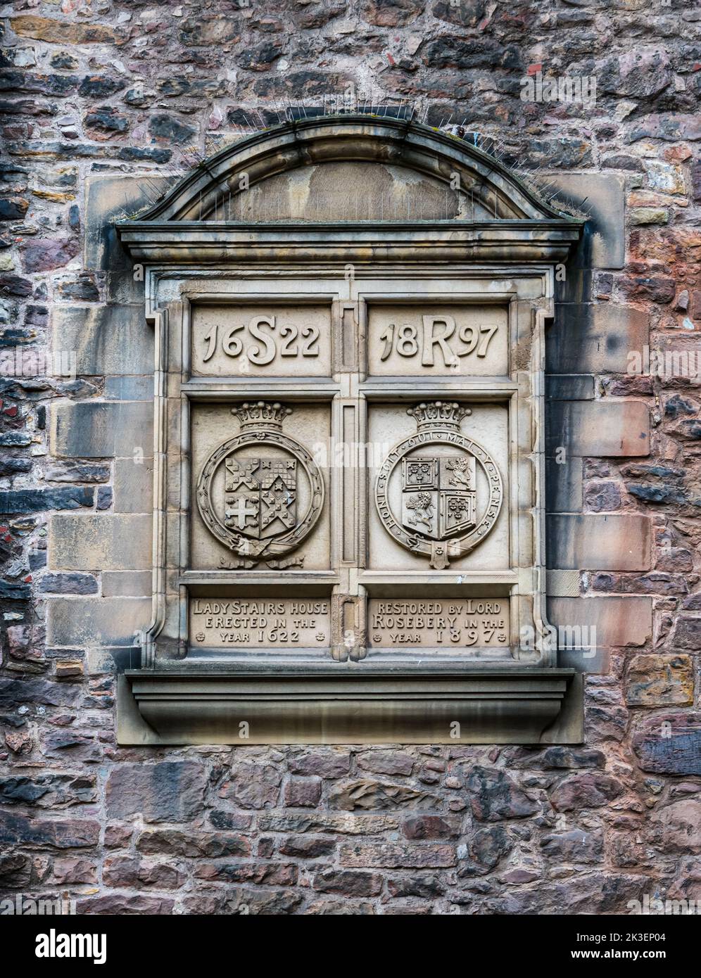 Carved dated inscription on wall with construction & restoration dates, Writer's Museum, Makar's Court, Edinburgh, Scotland, UK Stock Photo