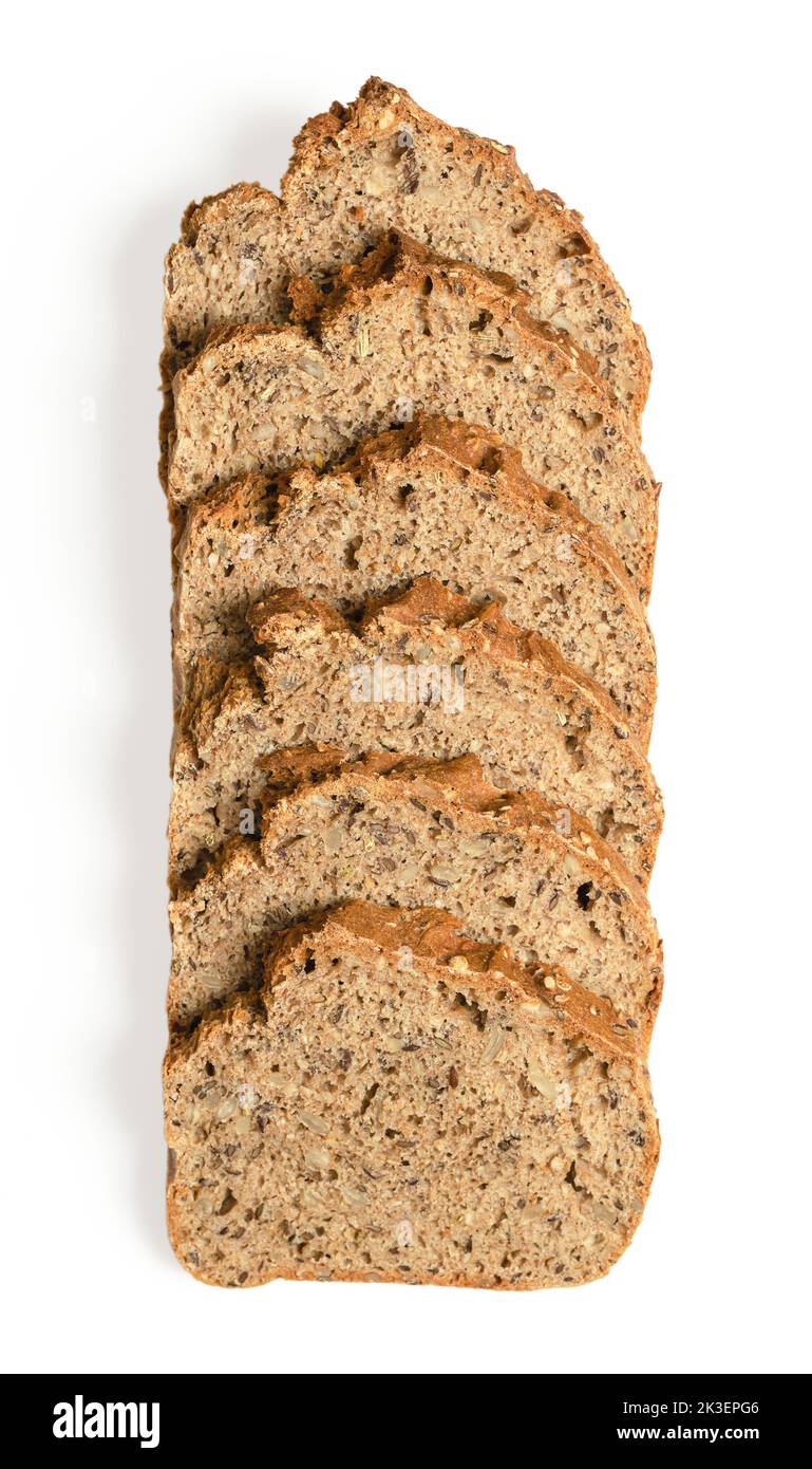 Overlapped slices of spelt bread, from above, on white background. Homemade and crusty baked, fresh dark bread, made of wholemeal spelt. Stock Photo