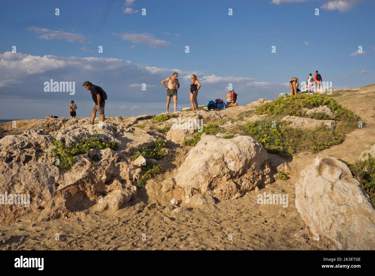 Local people and tourists at a beach by the old town of Monopoli, Puglia,Italy Stock Photo
