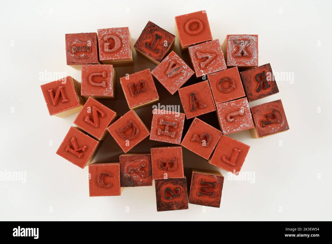 rubber stamps of letters of the Latin alphabet in disarray on a neutral background Stock Photo