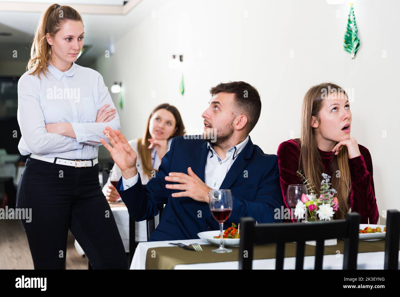 Man is talking with woman stranger in time dinner with girlfriend Stock ...