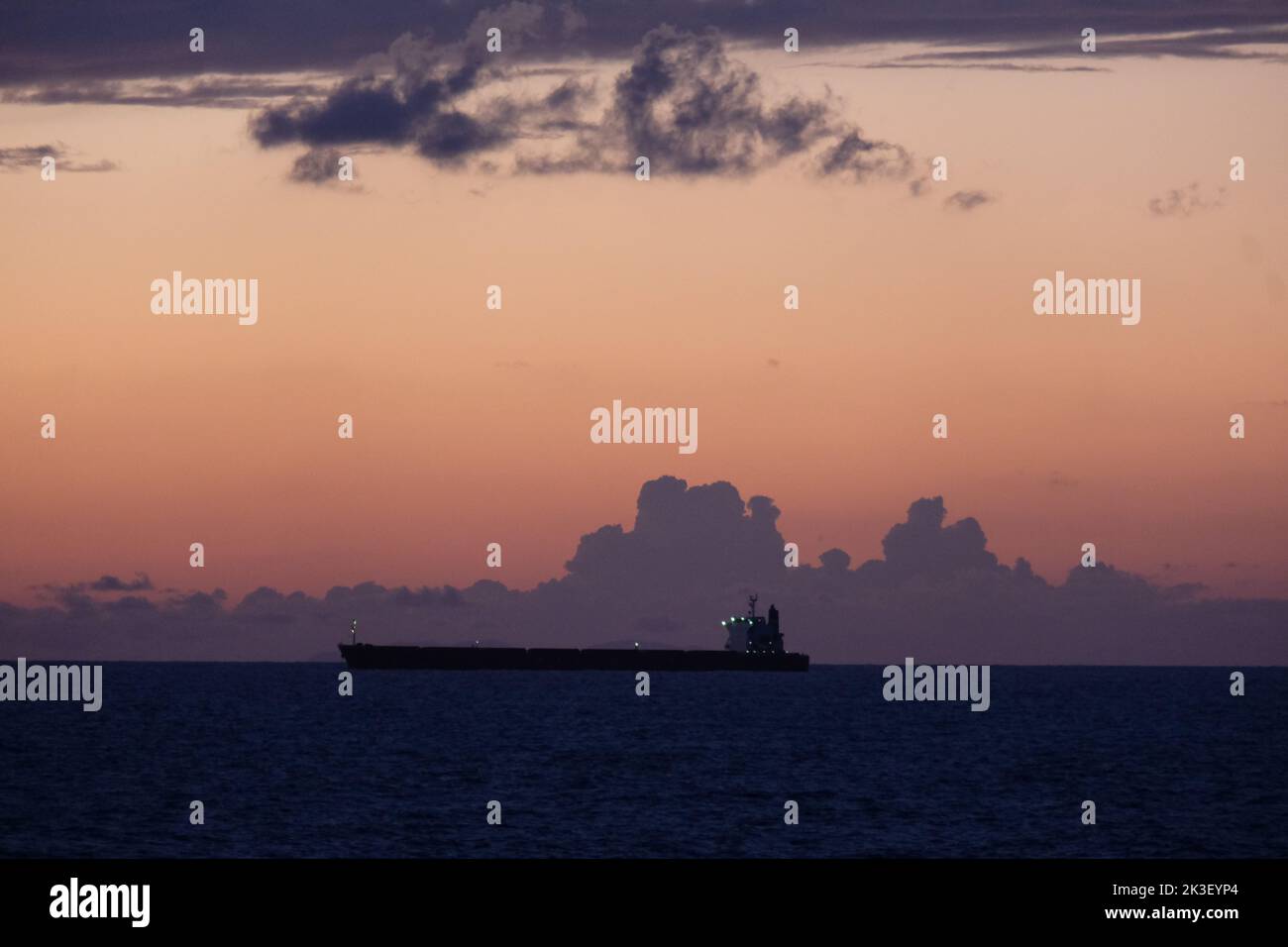 Sunset Seascape with Clouds and Ships on the Horizon Stock Photo - Alamy