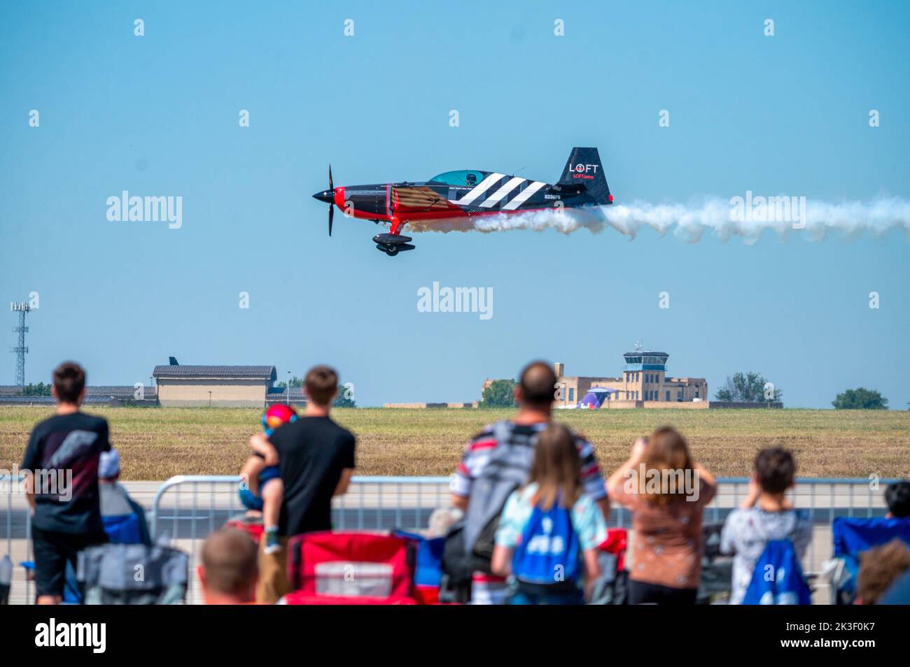 Adam Shakenbake Baker performs aerobatics in his Extra-330 aircraft during the 2022 Frontiers in Flight Air Show at McConnell Air Force Base, September 24, 2022 in Wichita, Kansas. Stock Photo
