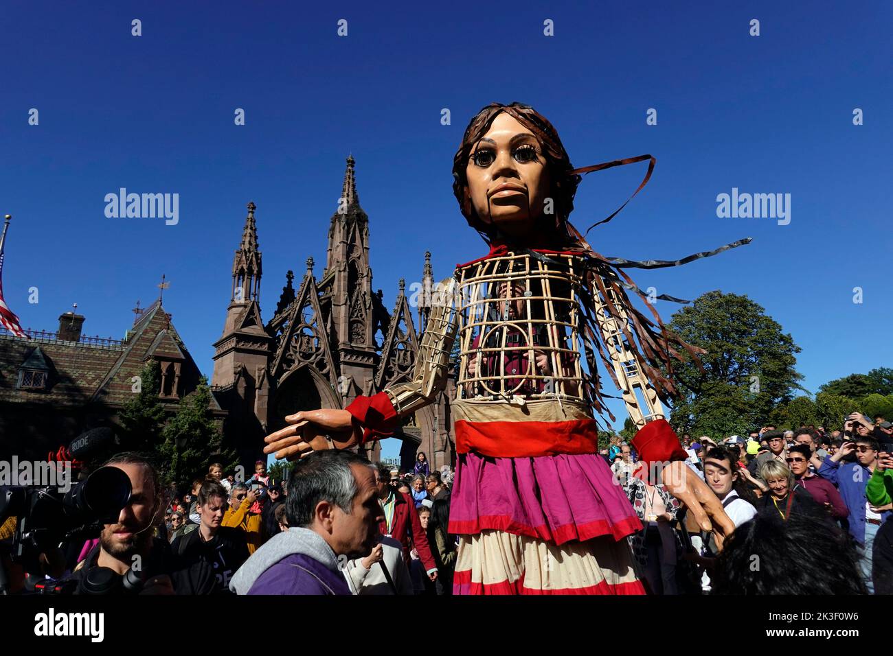 Little Amal refugee from Syria puppet traveling the world in search of her mother. She is at Greenwood cemetery in Brooklyn NYC Stock Photo