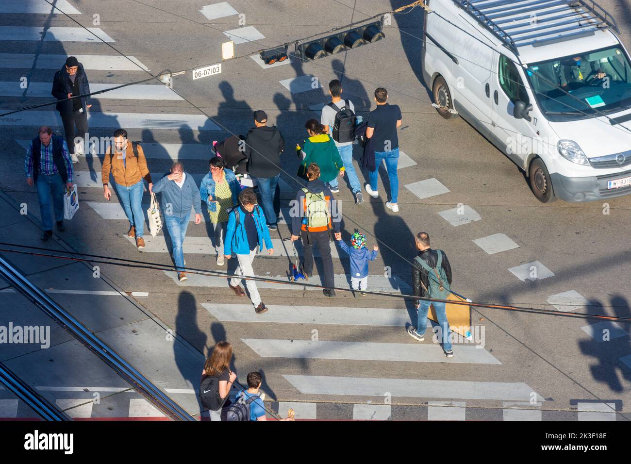 Wien, Vienna: pedestrians on crosswalk of crossroad, car in 15. Rudolfsheim-Fünfhaus, Wien, Austria Stock Photo
