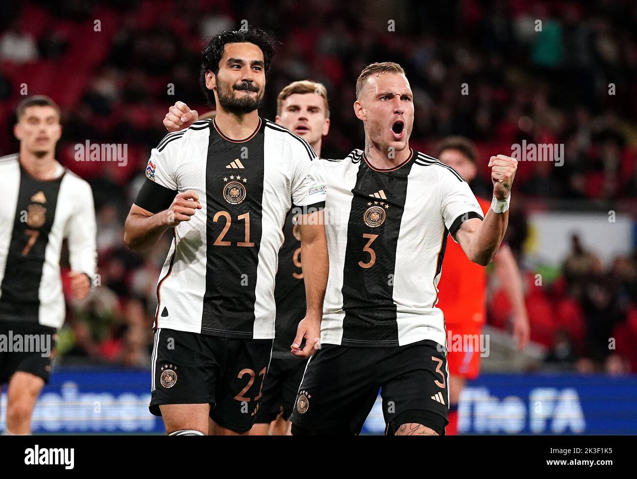 Germany's Ilkay Gundogan celebrates scoring their side's first goal of the game with team-mates during the UEFA Nations League match at Wembley Stadium, London. Picture date: Monday September 26, 2022. Stock Photo