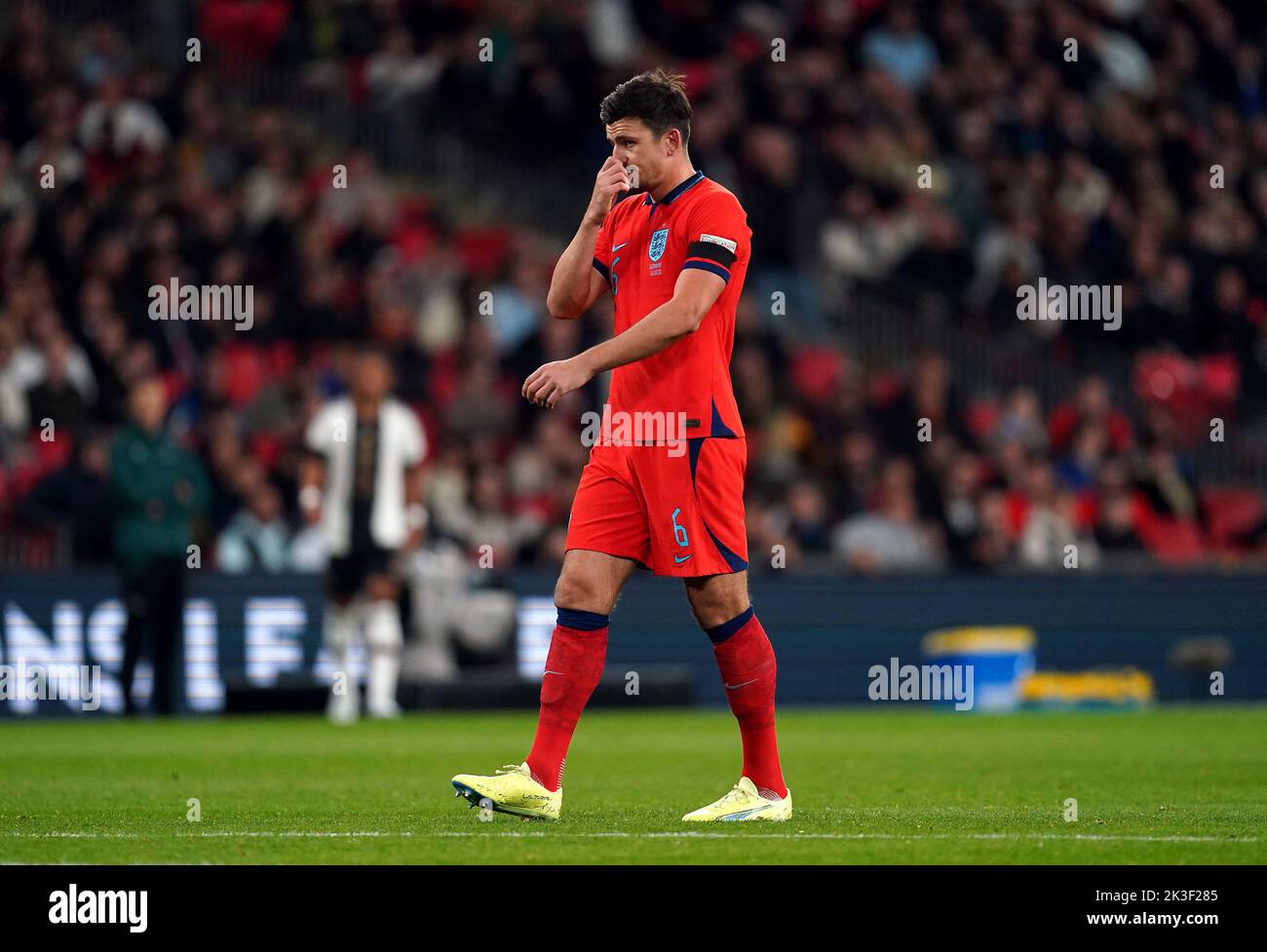 England's Harry Maguire reacts after he concedes a penalty during the UEFA Nations League match at Wembley Stadium, London. Picture date: Monday September 26, 2022. Stock Photo