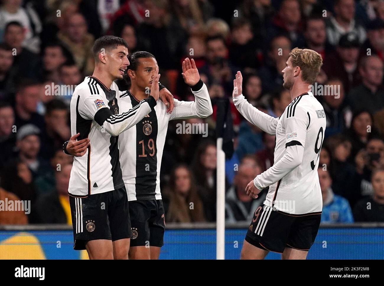 Germany's Kai Havertz celebrates scoring their side's second goal of the game with team-mates Leroy Sane and Timo Werner (right) during the UEFA Nations League match at Wembley Stadium, London. Picture date: Monday September 26, 2022. Stock Photo