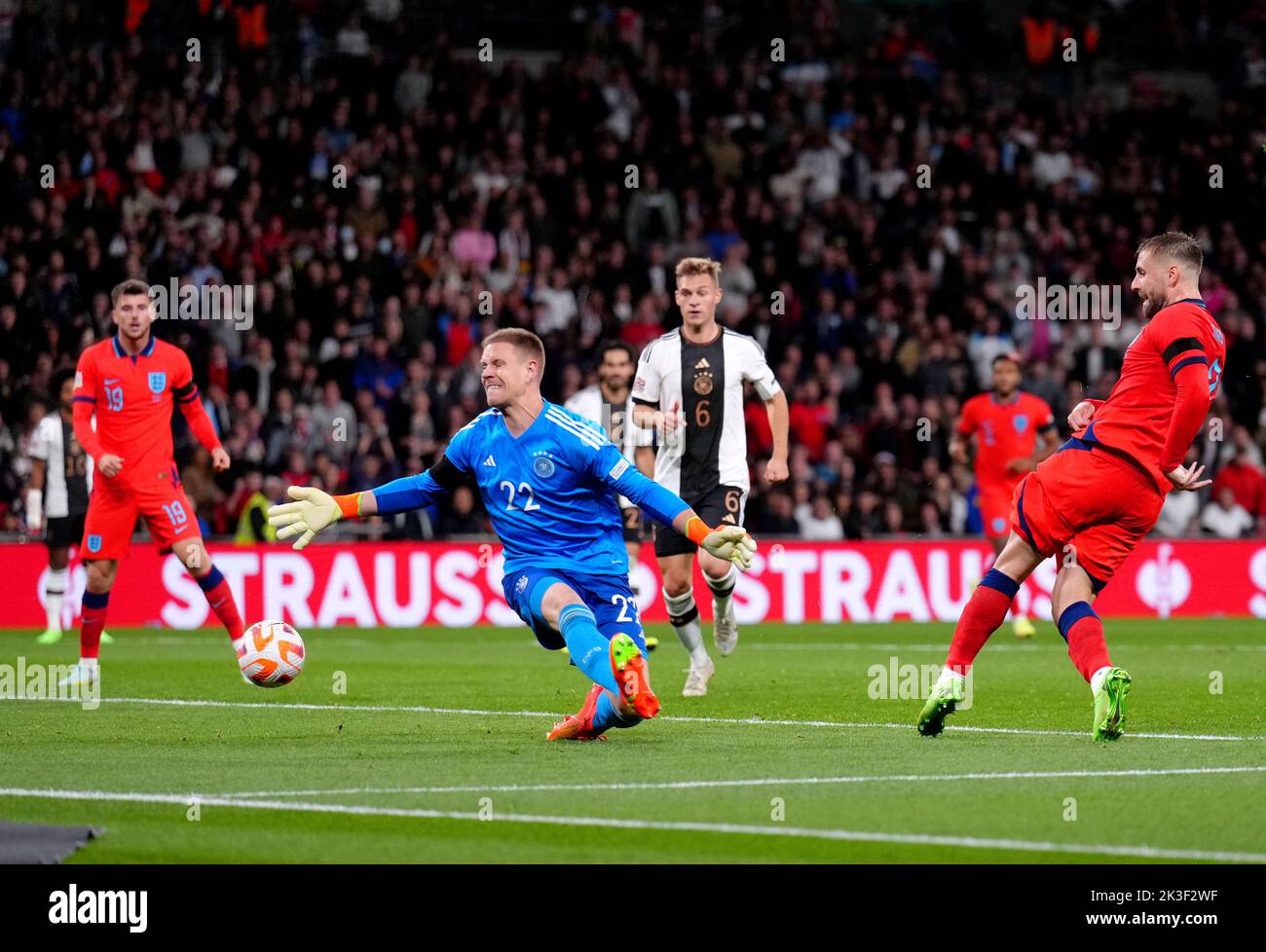 England's Luke Shaw (right) scores their side's first goal of the game during the UEFA Nations League match at Wembley Stadium, London. Picture date: Monday September 26, 2022. Stock Photo