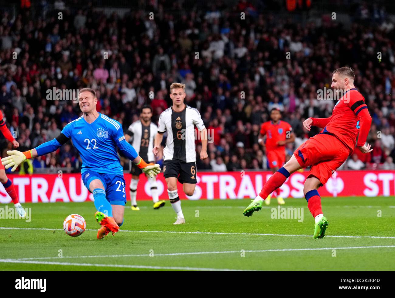 England's Luke Shaw (right) scores their side's first goal of the game during the UEFA Nations League match at Wembley Stadium, London. Picture date: Monday September 26, 2022. Stock Photo