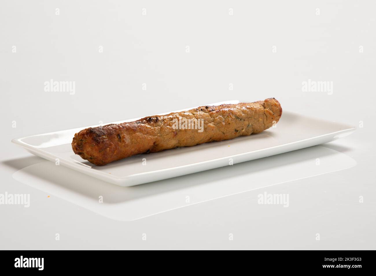 Seekh Kabab made with minced chicken or Mutton keema, served with green chutney and salad Stock Photo
