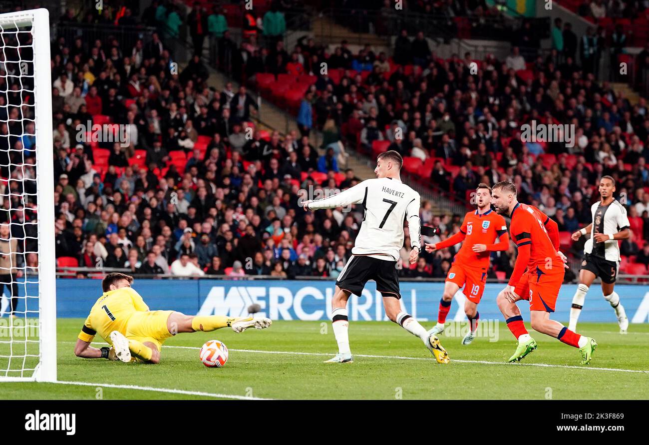 Germany's Kai Havertz scores their side's third goal of the game past England goalkeeper Nick Pope during the UEFA Nations League match at Wembley Stadium, London. Picture date: Monday September 26, 2022. Stock Photo