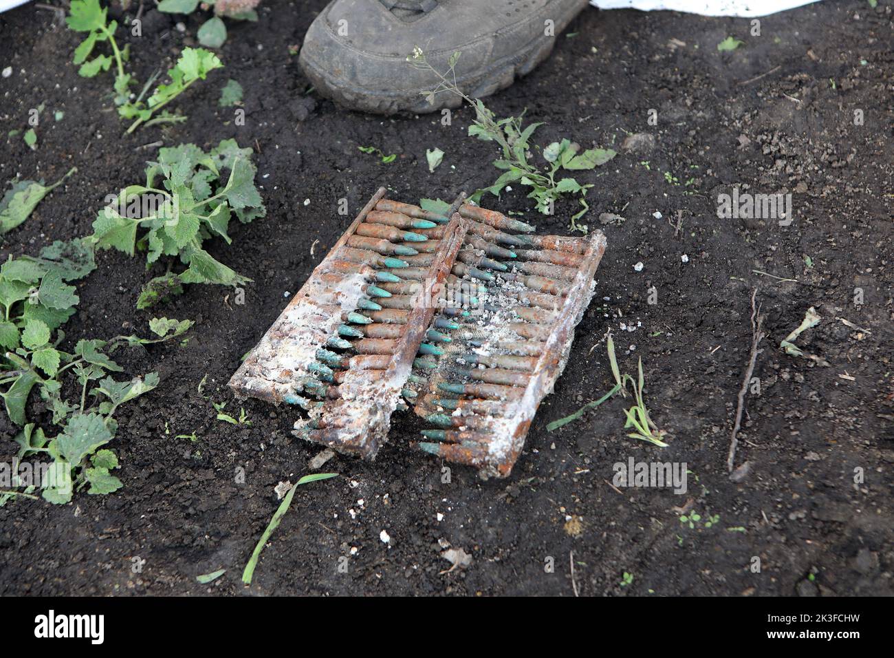 KHARKIV REGION, UKRAINE - SEPTEMBER 26, 2022 - Rusted ammunition found during the exhumation of the bodies of Ukrainian soldiers killed in action in the village of Dementiyivka recently liberated from russian invaders, in the north of Kharkiv Region, north-eastern Ukraine. Stock Photo