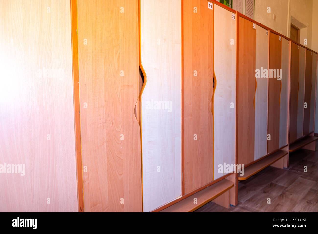 Colorful wooden lockers. Kids study. Children lockers. School