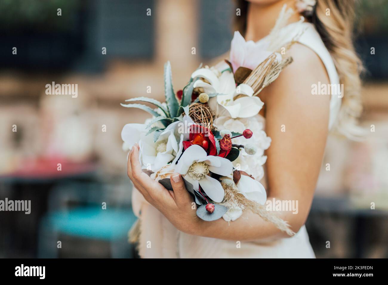 The bride and the flowers in her hand. Stock Photo