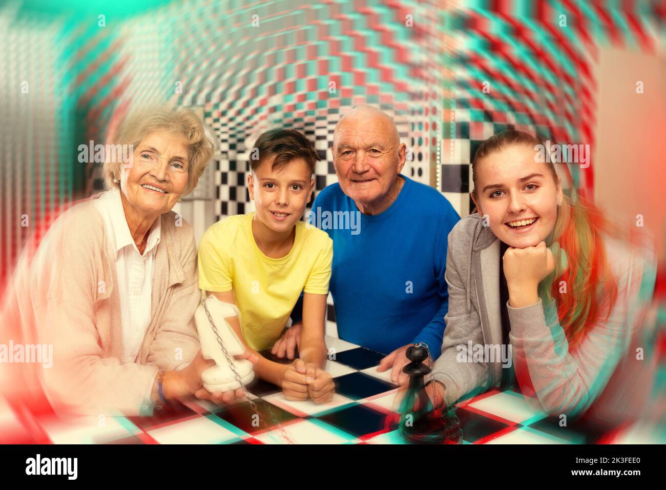 Grandkids and grandparents in escape room Stock Photo
