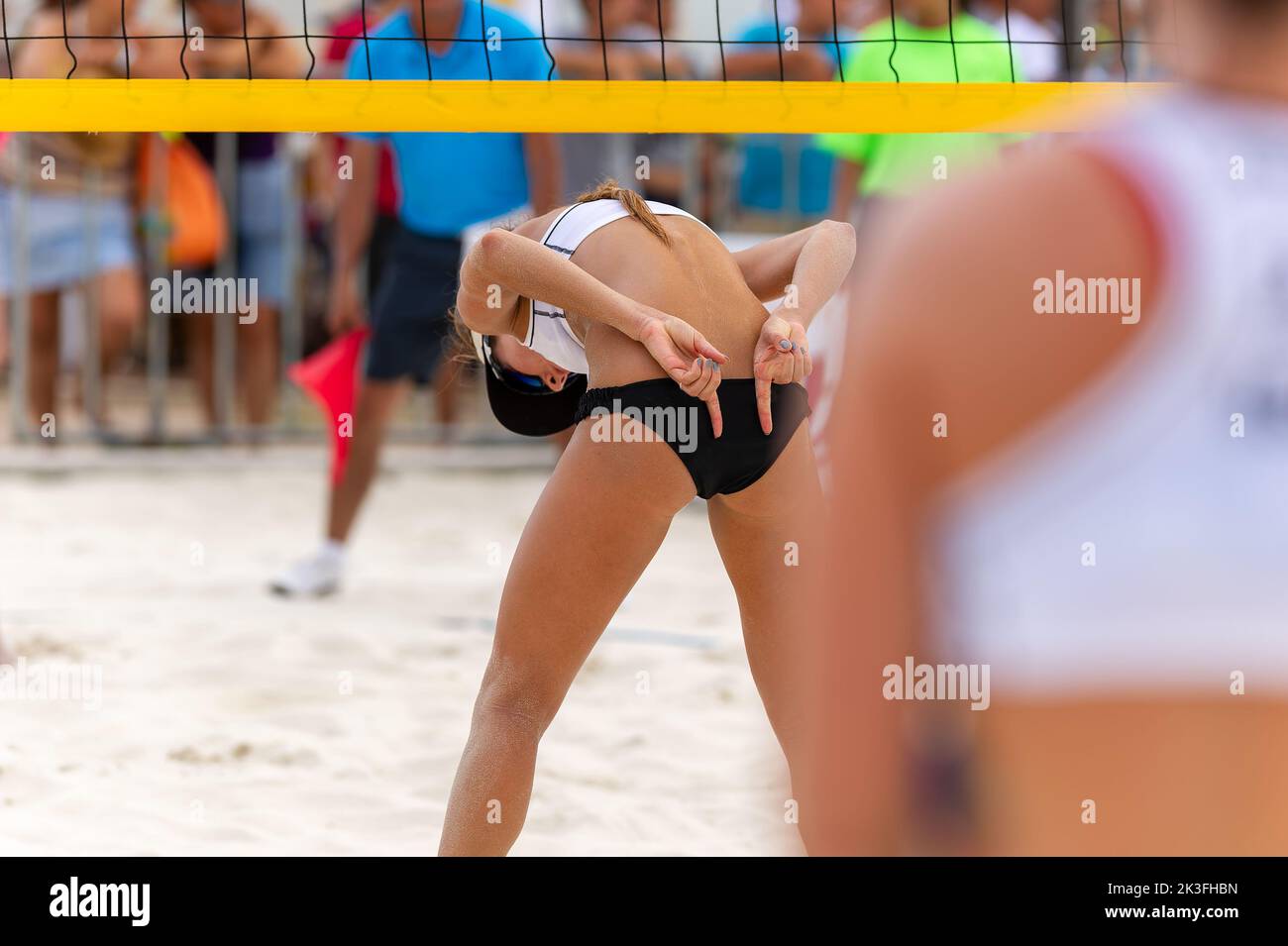 A Beach Volleyball Player Is Sending Signals To Her Team Mate Stock Photo
