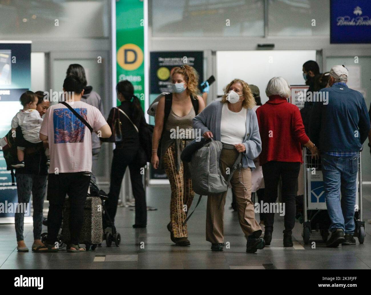 Richmond, Canada. 26th Sep, 2022. Travelers with face masks are seen at Vancouver International Airport in Richmond, Canada, on Sept. 26, 2022. The Canadian federal government announced Monday the removal of all COVID-19 entry restrictions, as well as testing, quarantine, and isolation requirements for anyone entering Canada, effective Oct. 1. Credit: Liang Sen/Xinhua/Alamy Live News Stock Photo