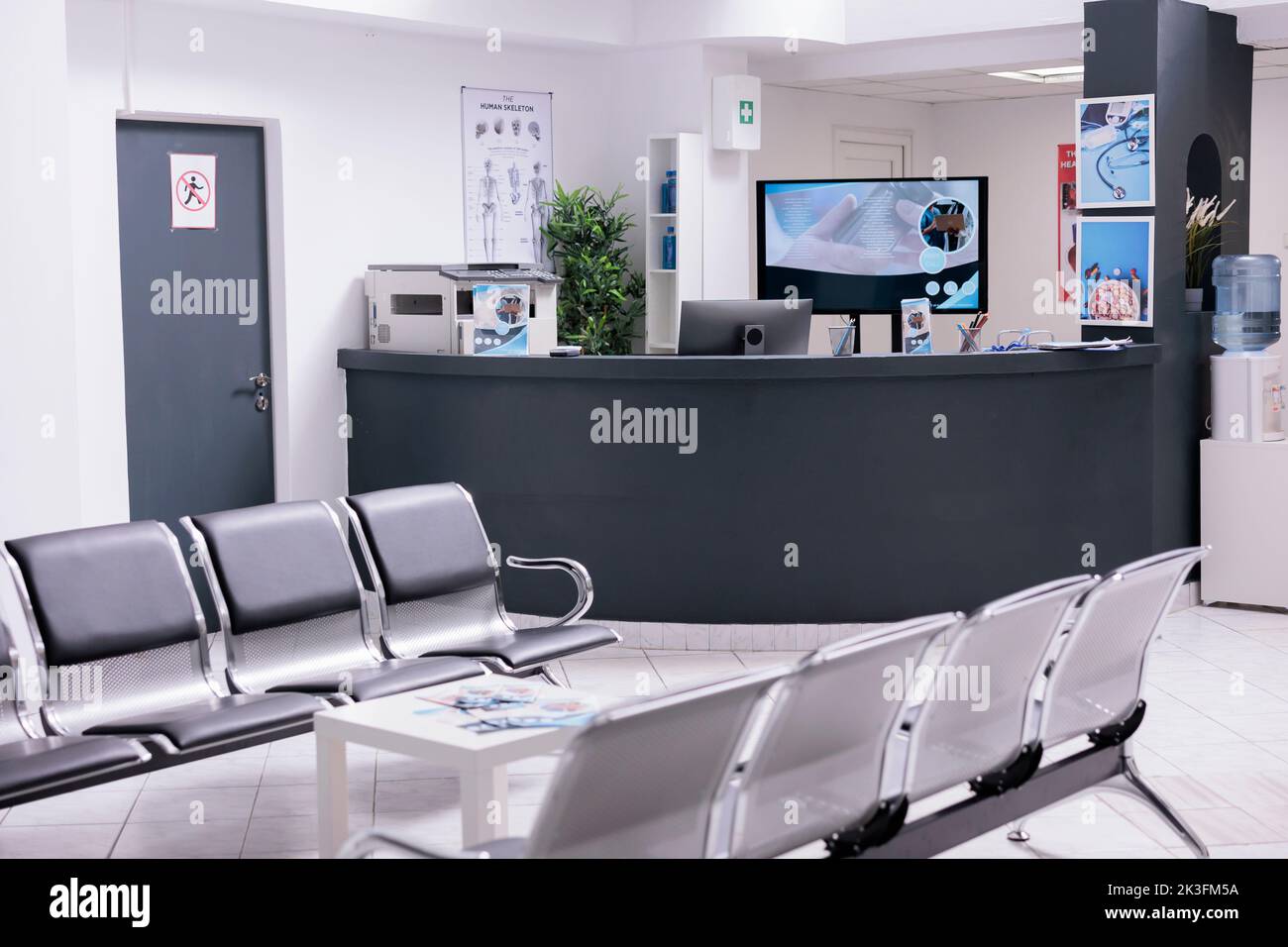 Clinical reception with waiting room in facility lobby, registration counter used for patients