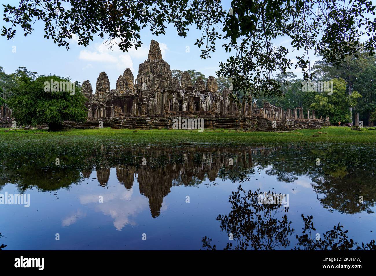 Cambodia. Siem Reap. The archaeological park of Angkor. The Bayon temple 12th century Hindu temple and its reflection on the lake Stock Photo