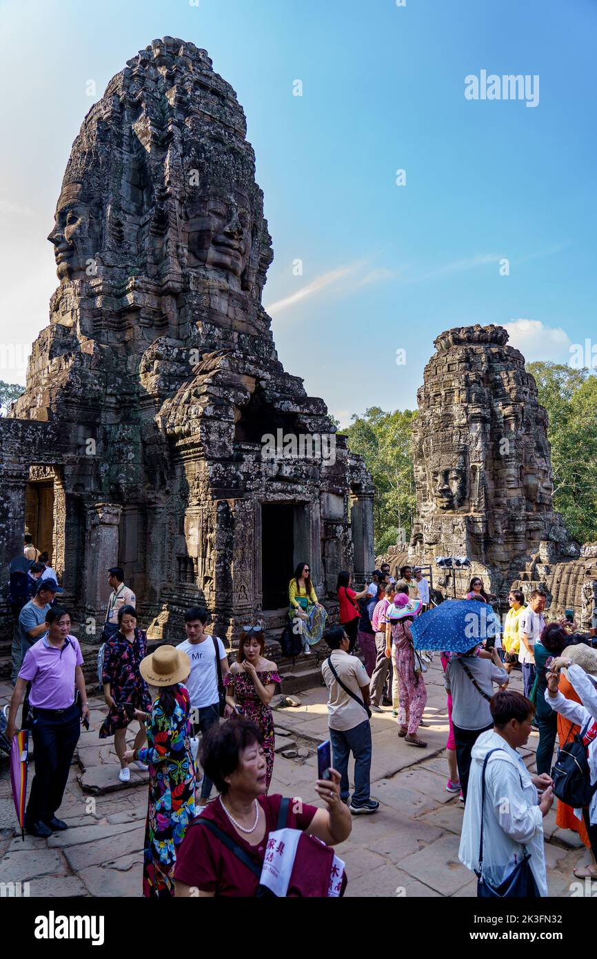 Cambodia. Siem Reap. The archaeological park of Angkor. Tourists visiting Bayon Temple 12th century Hindu temple Stock Photo