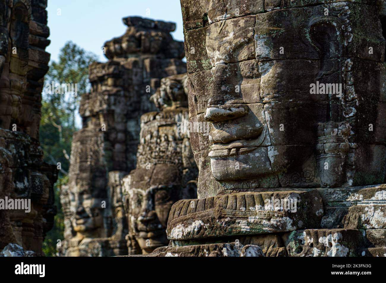 Cambodia. Siem Reap. The archaeological park of Angkor. Heads of Buddha sculpture at Bayon Temple 12th century Hindu temple Stock Photo