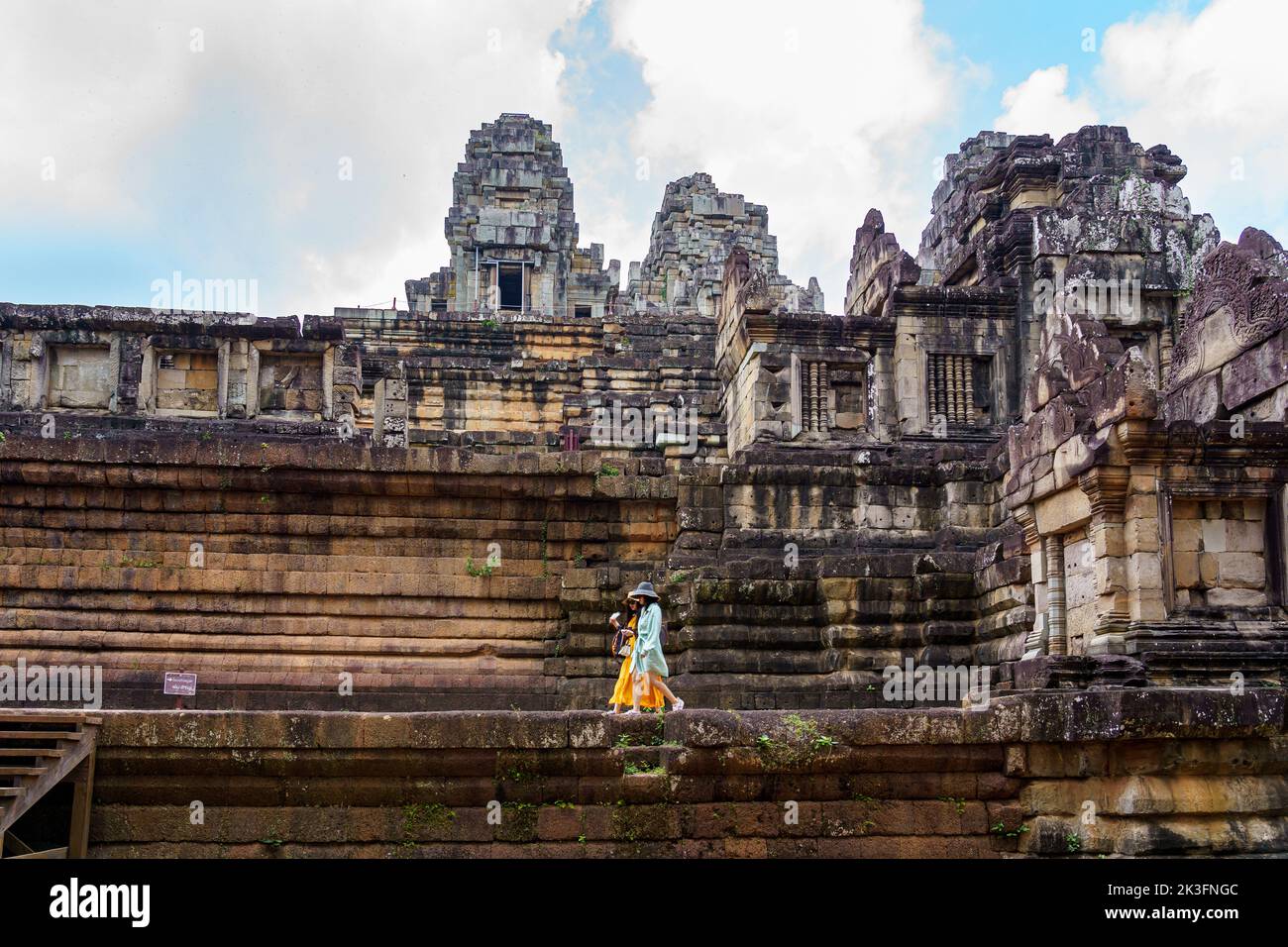 Cambodia. Siem Reap. The archaeological park of Angkor. A couple of women walking at Ta Keo Hindu temple Stock Photo