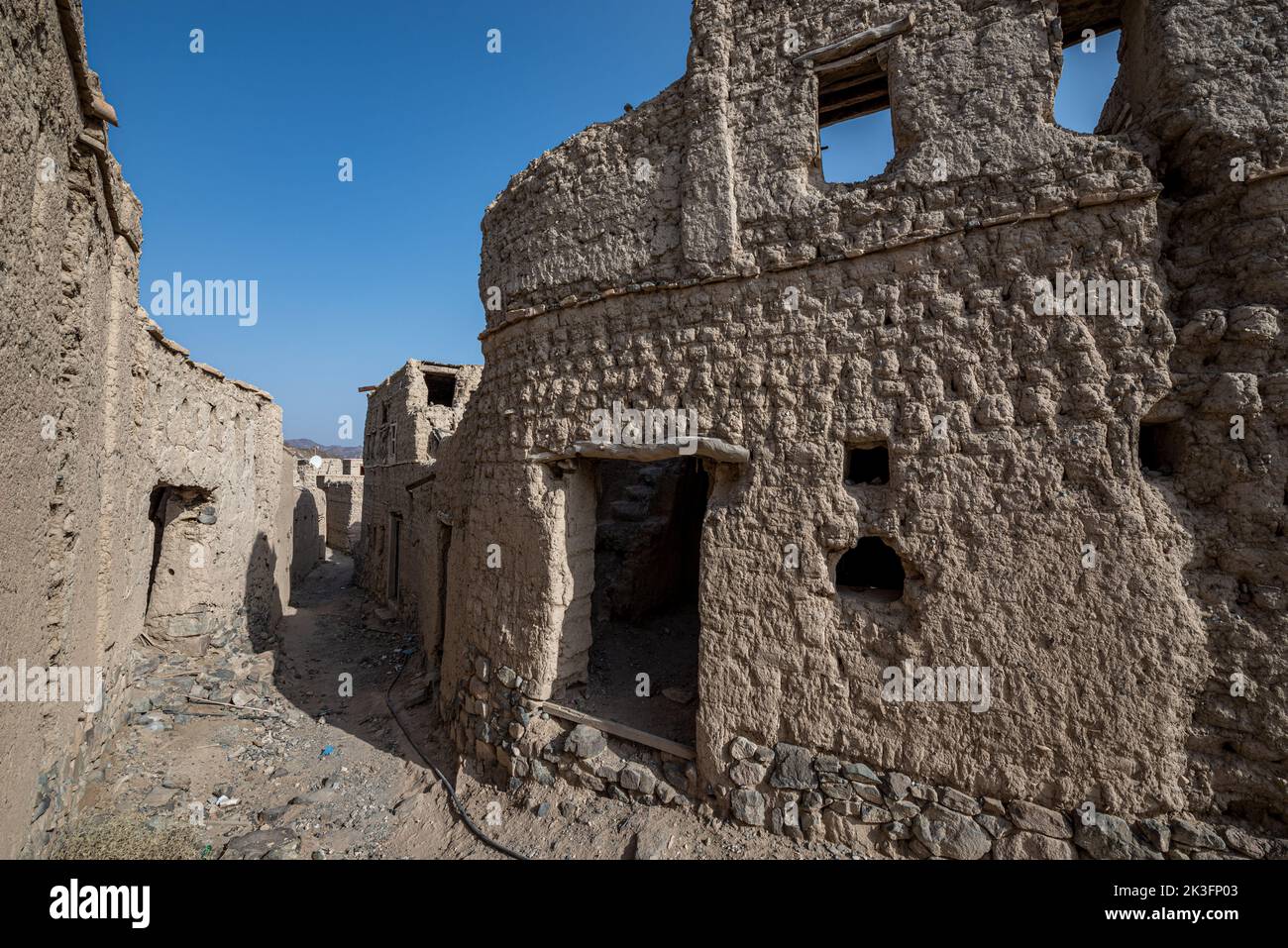 Mud-brick Bahla Fort Citadel and oasis on decay, Oman Stock Photo
