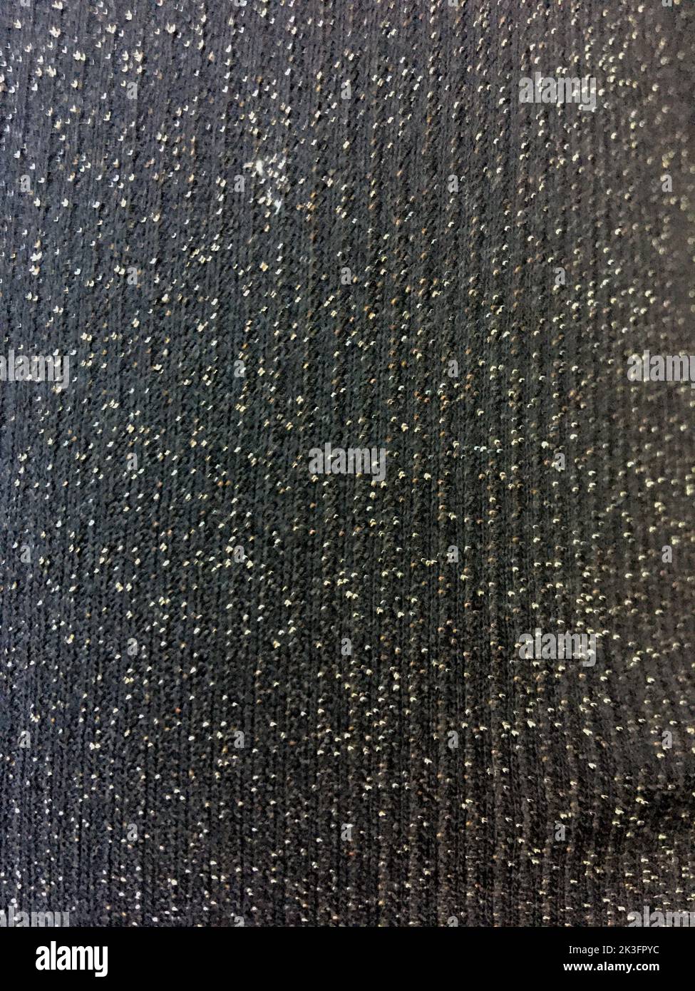 Black fabric texture with silver glitter sparkles close up Stock Photo