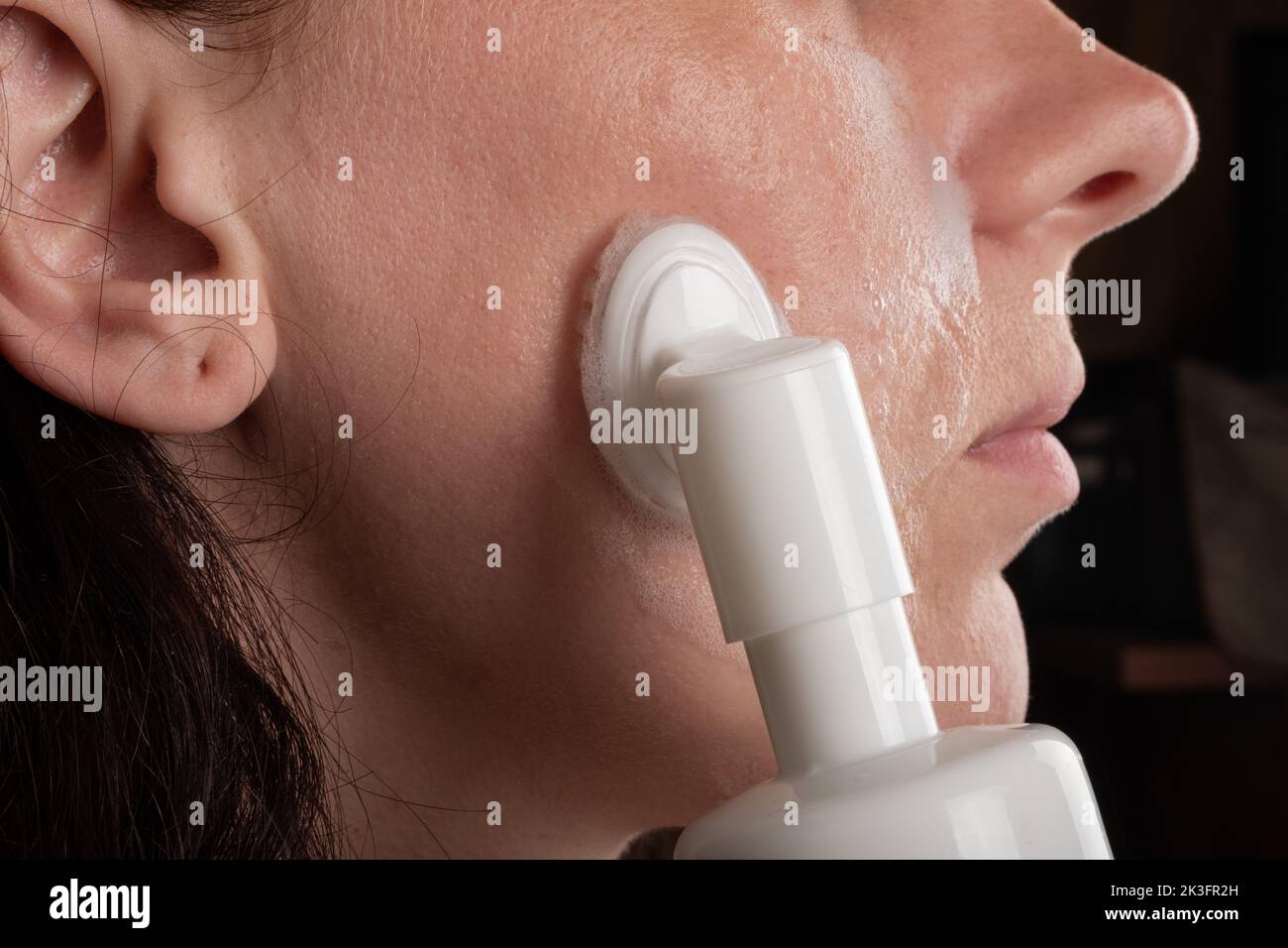 face cleaning with foam, cosmetic skin care.. Stock Photo