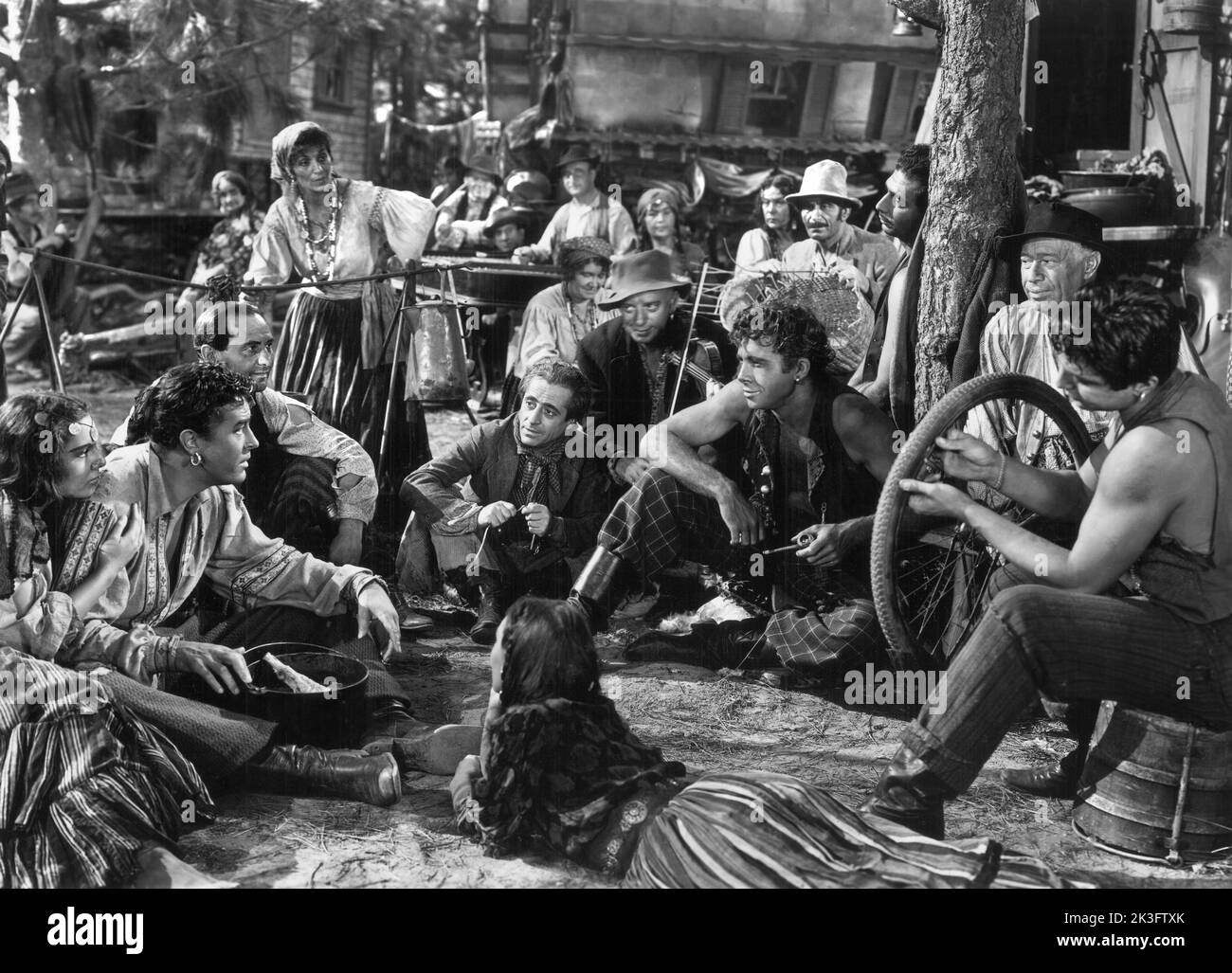 Ray Milland (seated, 2nd left) on-set of the Film, 'Golden Earrings', Paramount Pictures, 1947 Stock Photo