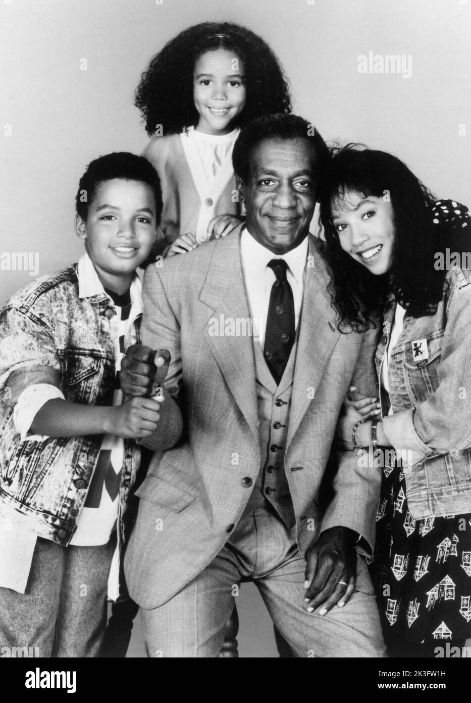 Salim Grant, Brooke Fontaine, Bill Cosby, Kimberly Russell, Publicity Portrait for the Film, 'Ghost Dad', photo by Howard Bingham for Universal Pictures, 1990 Stock Photo