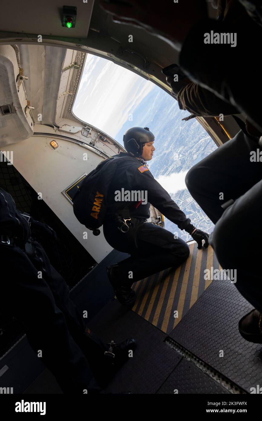 A U.S. Army Soldier with the U.S. Army Parachute Team prepares to jump during a demonstration at the 2022 Marine Corps Air Station Miramar Air Show at MCAS Miramar, California, Sept. 24, 2022. Nicknamed the Golden Knights in 1962, “Golden” signifies the gold medals the team won in international competitions, and “Knights” alludes to the team’s ambition to conquer the skies. The Golden Knights perform in more than 100 events per year.  The theme for the 2022 MCAS Miramar Air Show, “Marines Fight, Evolve and Win,” reflects the Marine Corps’ ongoing modernization efforts to prepare for future con Stock Photo