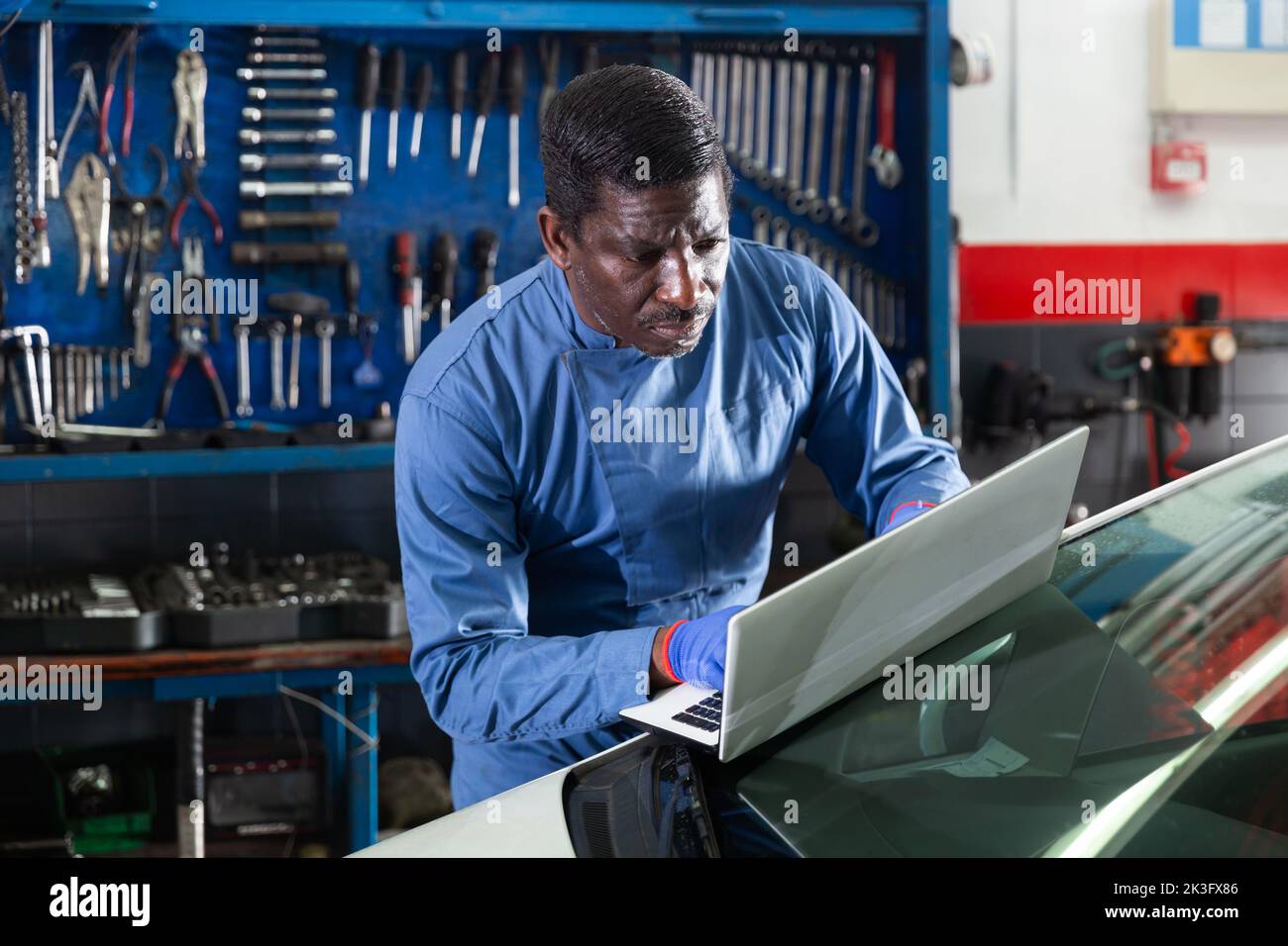 Mechanic Using A Computer African mechanic man using hi-res stock photography and images - Alamy