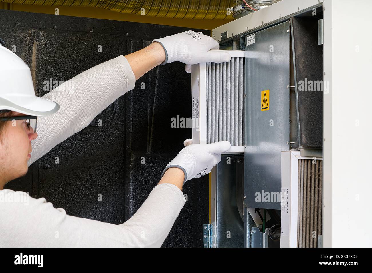 hvac filter replacement home central air system. servicemen changing