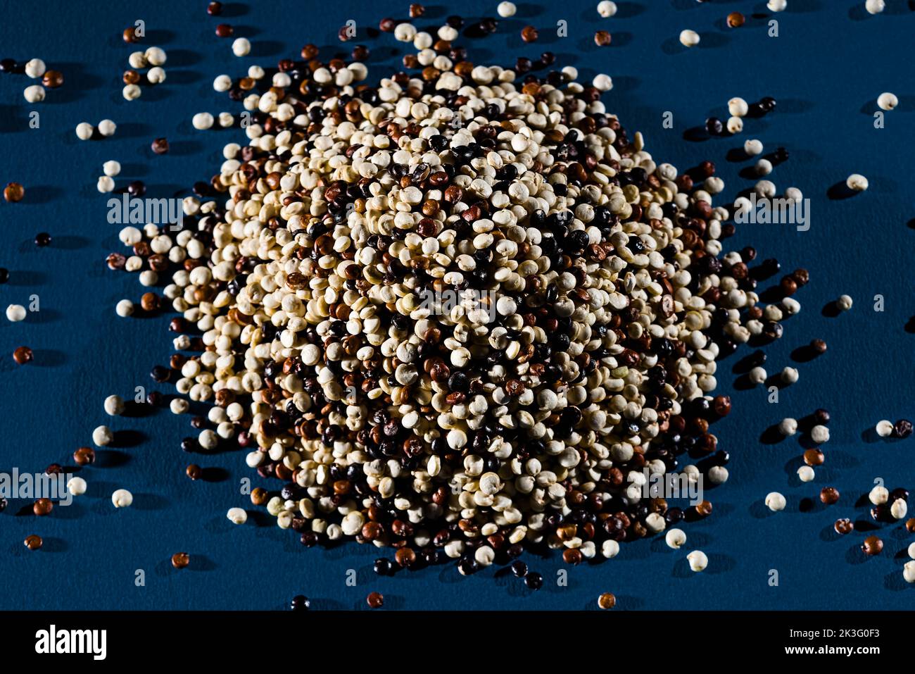 Quinoa seeds bunch heap of lysin superfood mix black red white Stock Photo