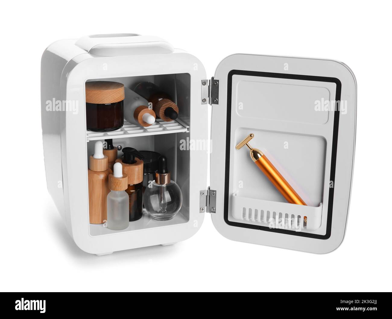 Small refrigerator with natural cosmetics and facial massage tool on