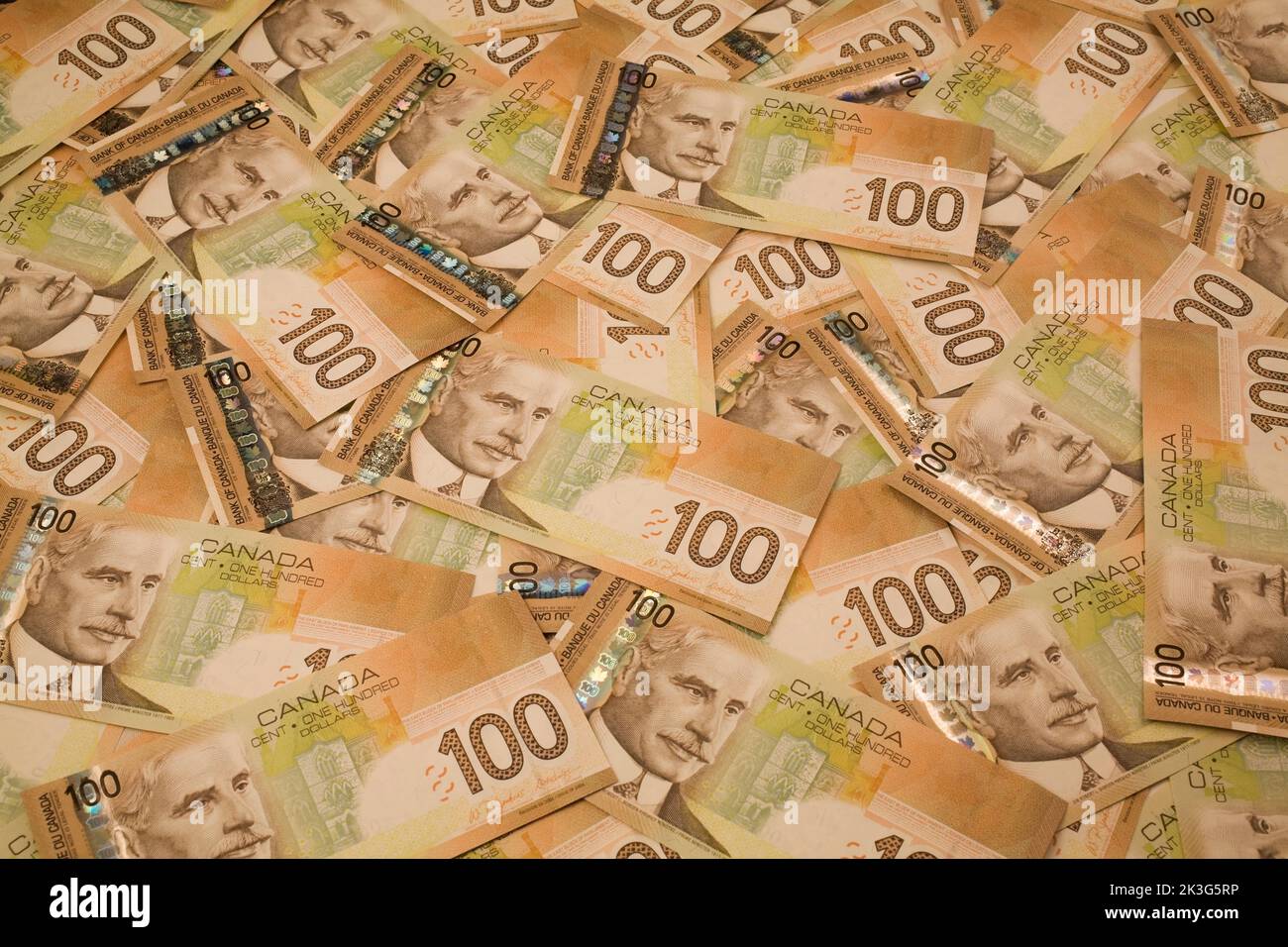 Canadian OneHundred dollar currency bank notes laid flat, Studio