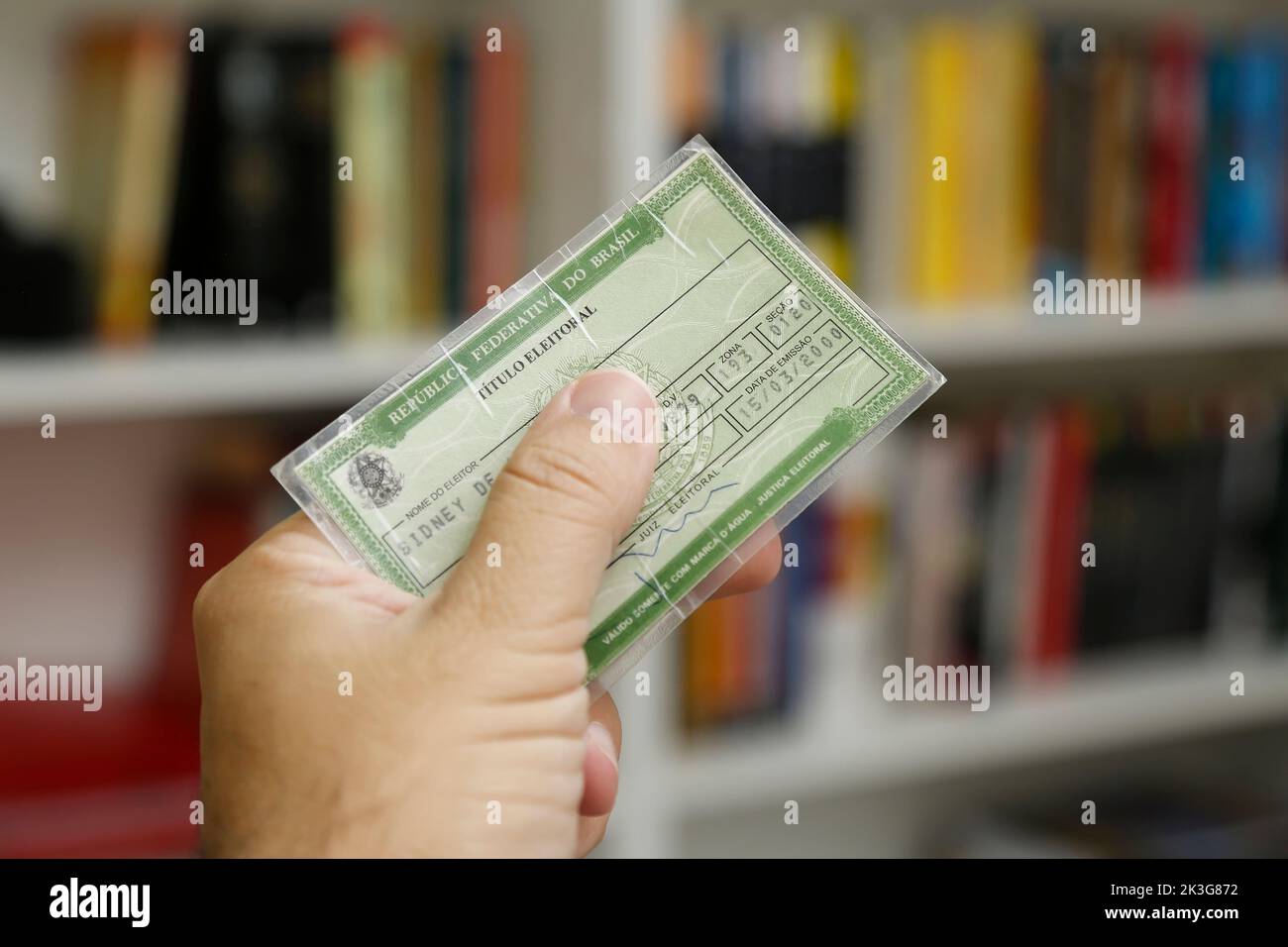 Minas Gerais, Brazil - September 25, 2022: hand holding an electoral card, document used to vote in Brazil Stock Photo