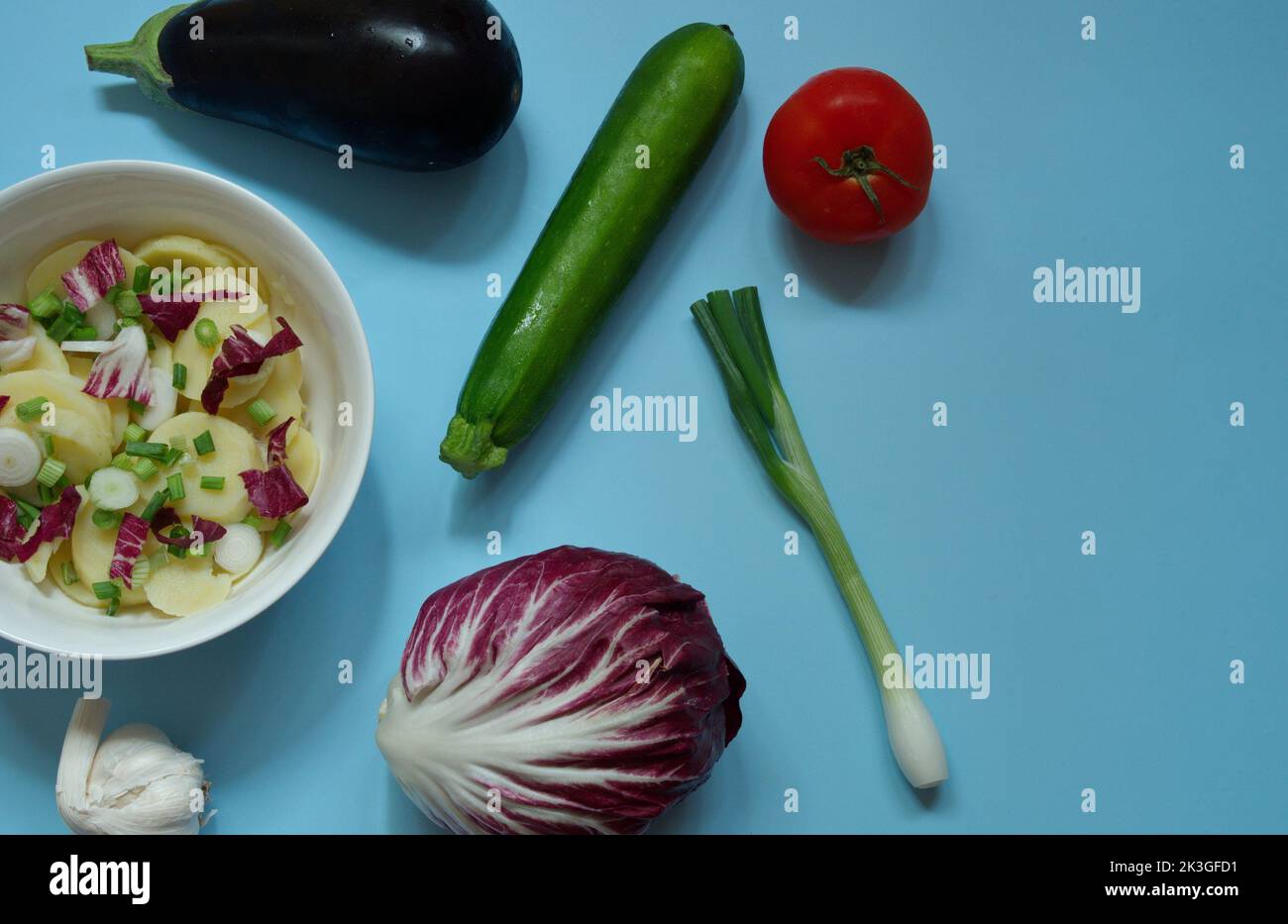 Flat lay of various vegetables on blue background Stock Photo