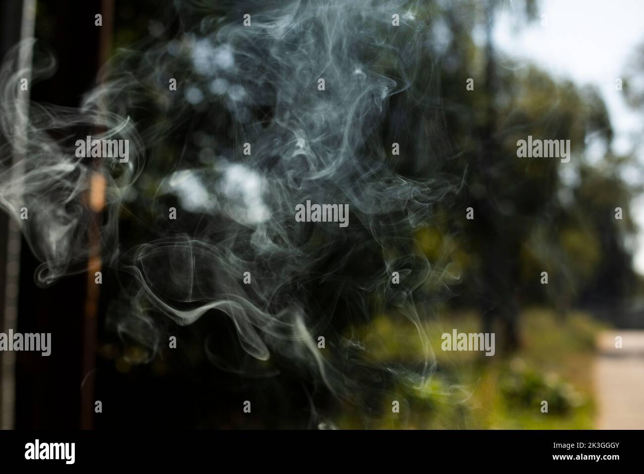 Smoke in air. Smoke flies. Simple background with hot air particles. Murky photo. Stock Photo