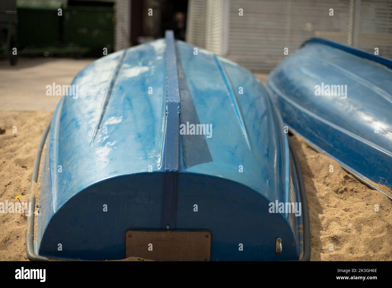 Blue boats on sand. Boat station. Boats dry up on shore. Stock Photo