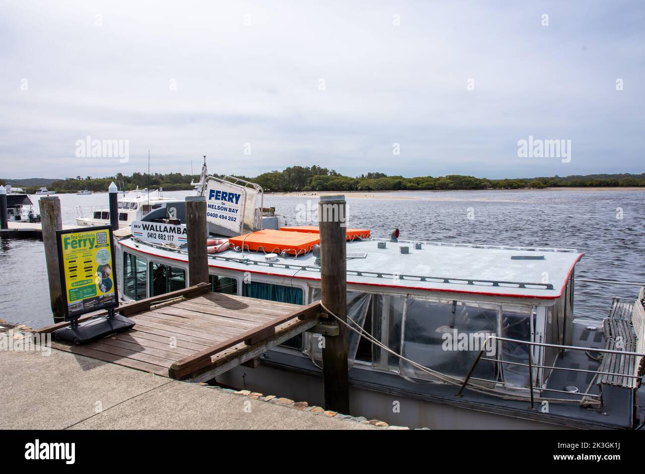 Small Ferry on Myall River at Tea Gardens operating to and from Nelson Bay, Mid North Coast NSW Australia. Stock Photo