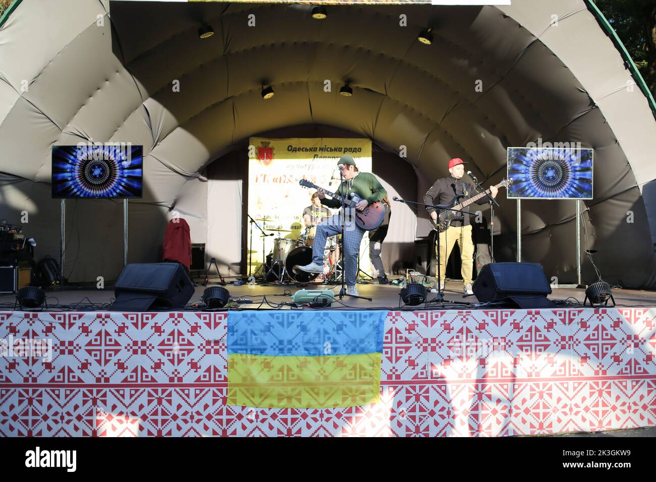 Stanislav Yasko (C), Valentin Olekhnovych (L), and Vladislav Biliy (R) from Stas Lenin Band are seen performing during the festival. The composition of the Stas Lenin Band - Stanislav Yasko - vocals, guitar, Valentin Olekhnovych - drums, Vladislav Biliy - guitar. The purpose of the 'Family Weekend ' festival is to raise funds for the purchase of a mobile dental office for the Armed Forces of Ukraine. During the festival, visitors had the opportunity to listen to a concert, take photos with vintage cars, watch cheerleaders perform, attend master classes for children. Stock Photo