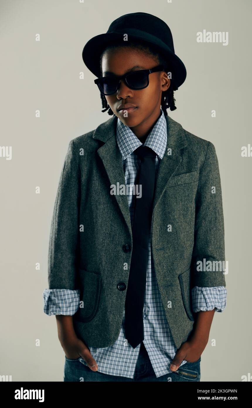 Dressed in his best. Studio portrait of a young ethnic boy dressed in a smart outfit. Stock Photo
